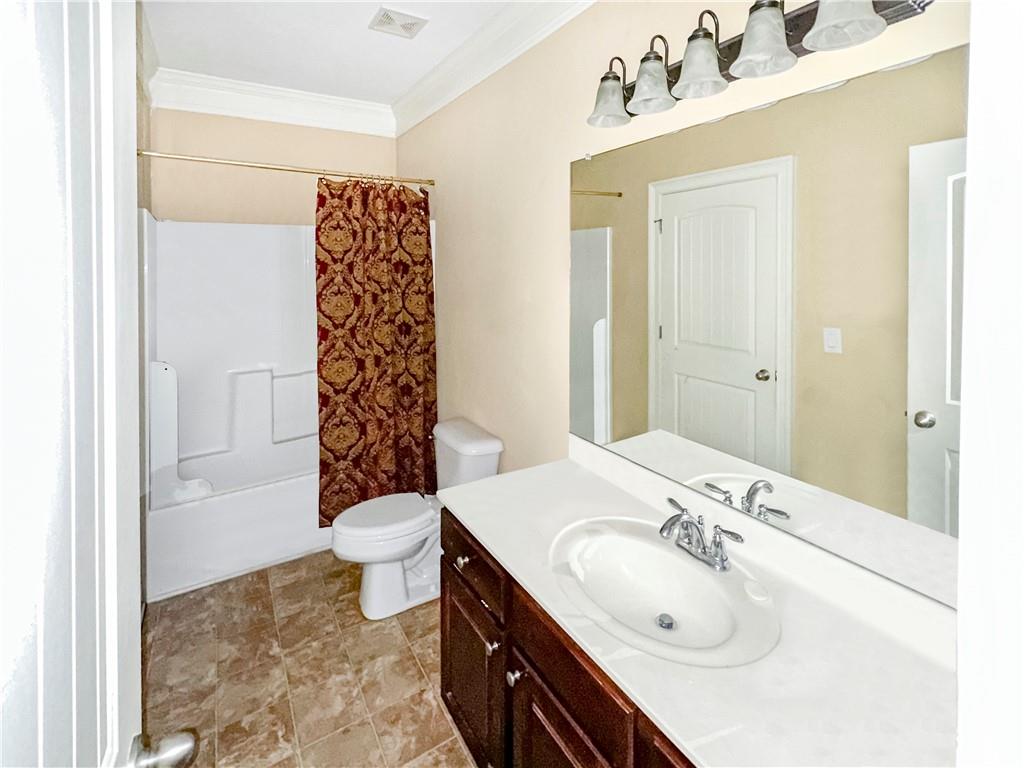 142 Liberty Trace Milner, GA 30257 - Photo 16 of 33 a bathroom with a sink a toilet and shower