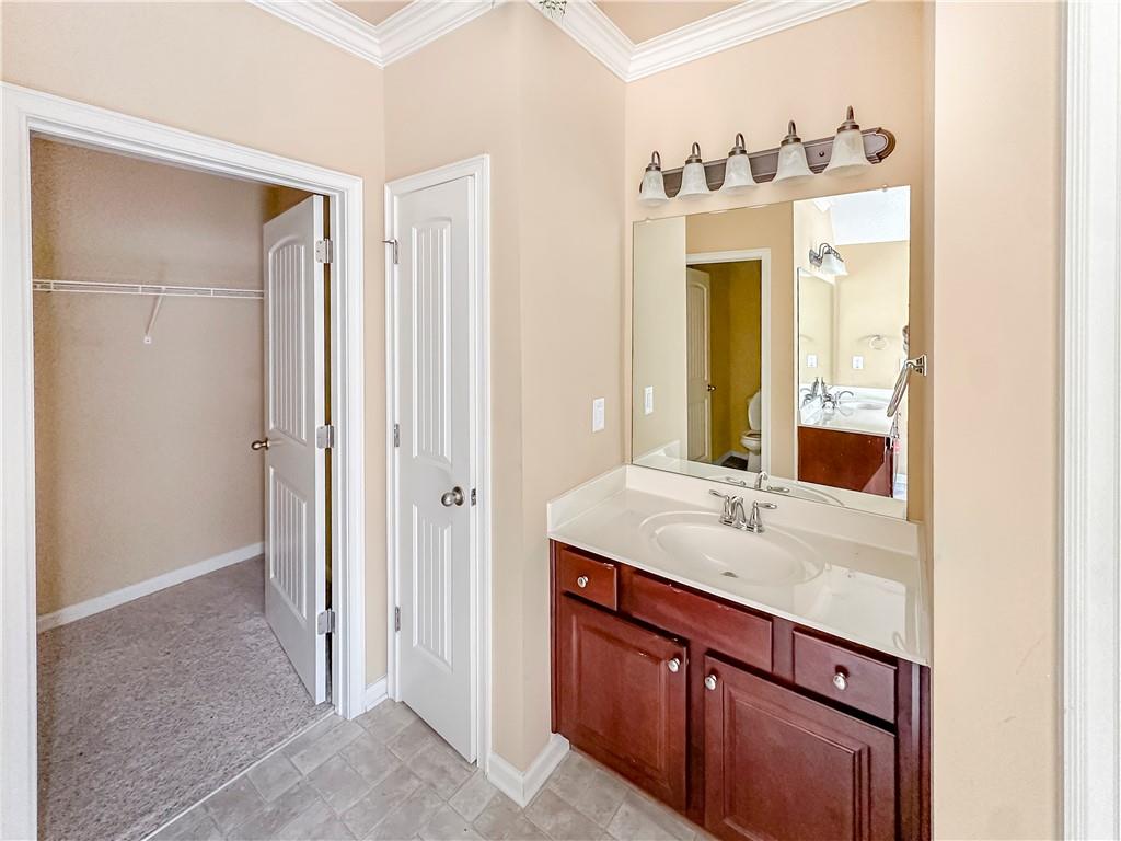142 Liberty Trace Milner, GA 30257 - Photo 18 of 33 a bathroom with a granite countertop sink and a mirror