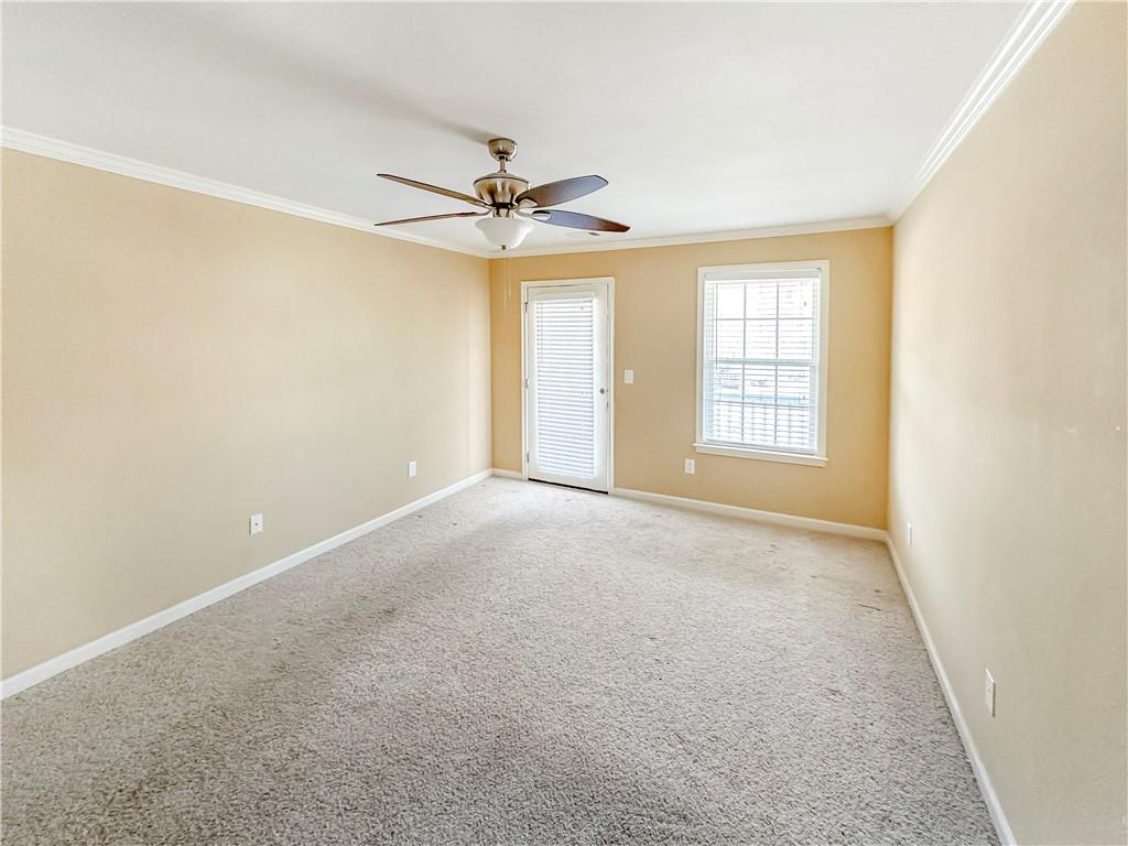 142 Liberty Trace Milner, GA 30257 - Photo 24 of 33 an empty room with windows and fan