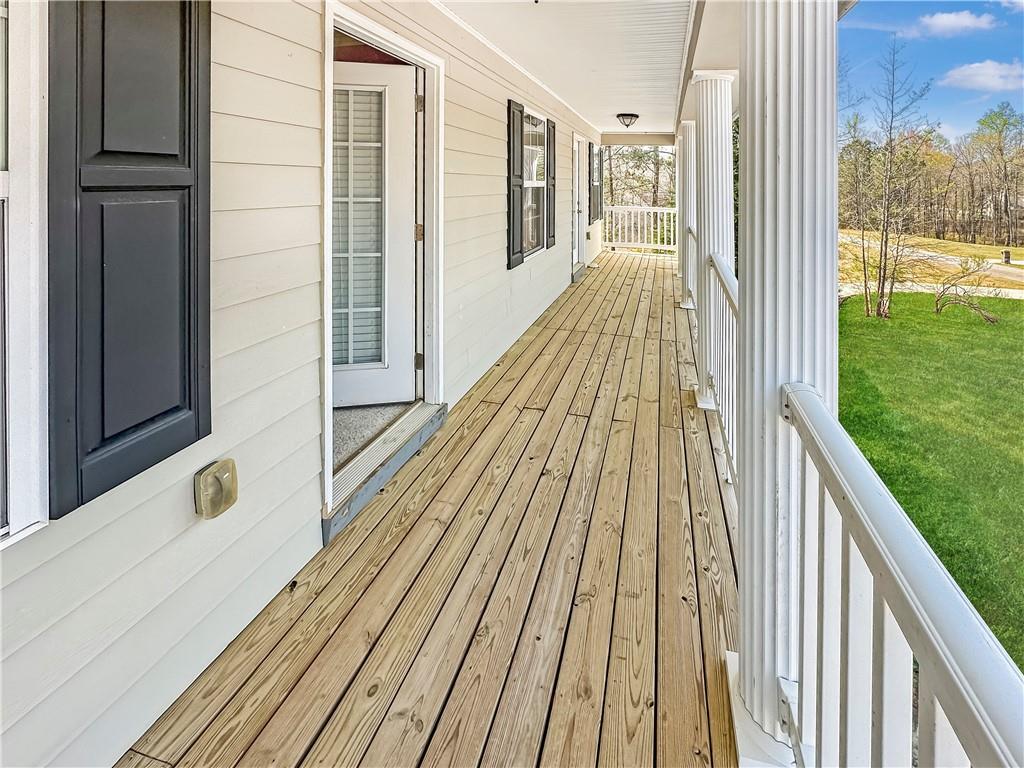 142 Liberty Trace Milner, GA 30257 - Photo 30 of 33 a view of balcony with wooden floor and fence