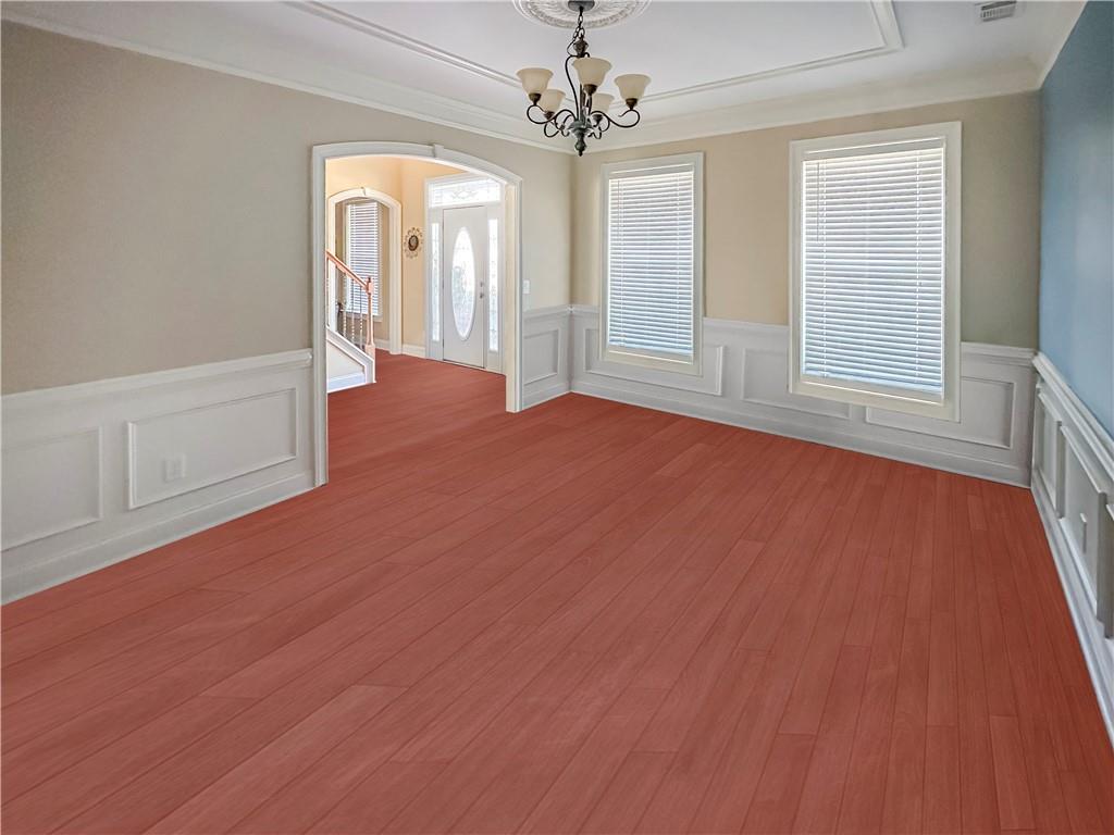 142 Liberty Trace Milner, GA 30257 - Photo 6 of 33 an empty room with wooden floor and windows