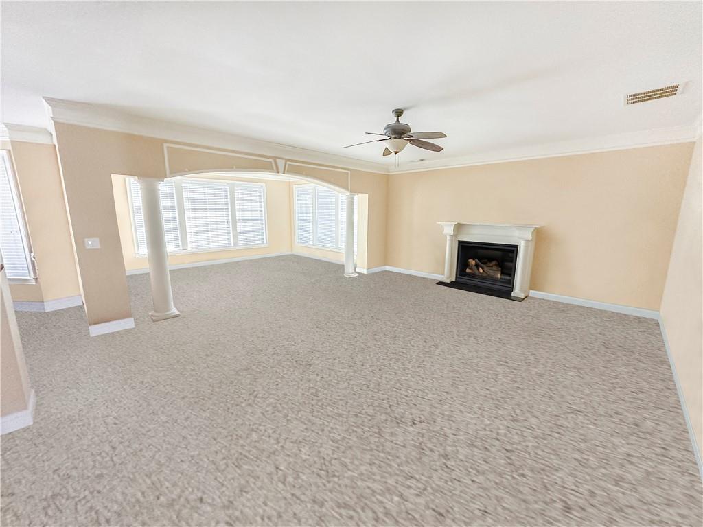 142 Liberty Trace Milner, GA 30257 - Photo 7 of 33 a view of empty room with a fireplace