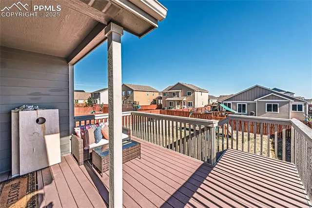 a view of a balcony with wooden floor