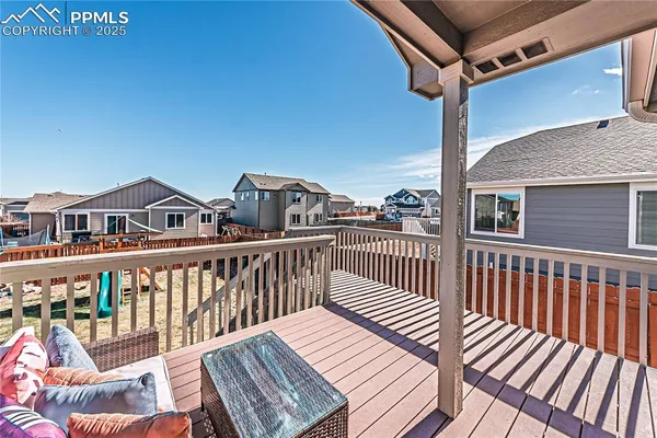 a view of a house with wooden deck