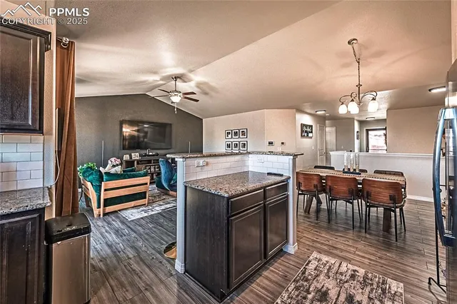 a kitchen that has a lot of cabinets in it