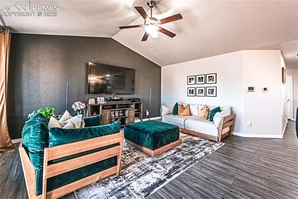 a living room with furniture and a flat screen tv