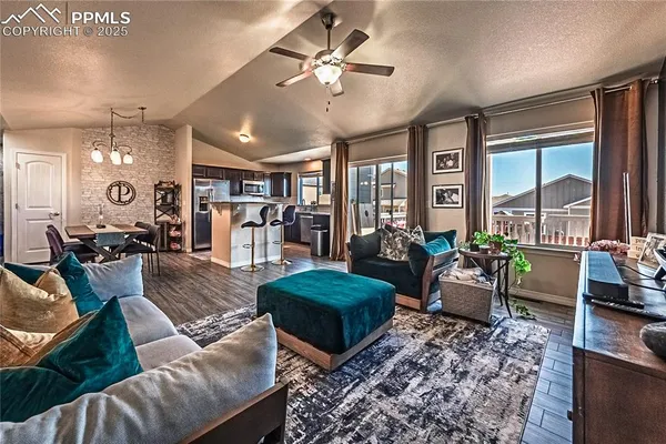 a living room with furniture and a large window