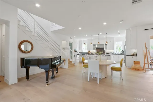 a kitchen with a table and chairs