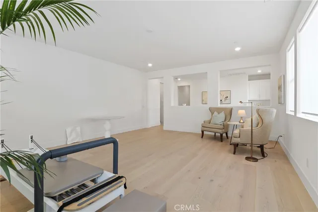 a bedroom with bed and window