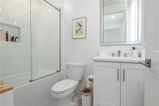 a living room with furniture a rug and a window