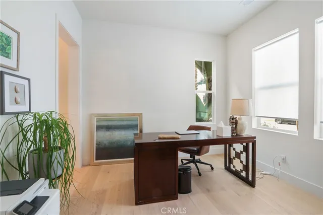 a workspace with furniture and window