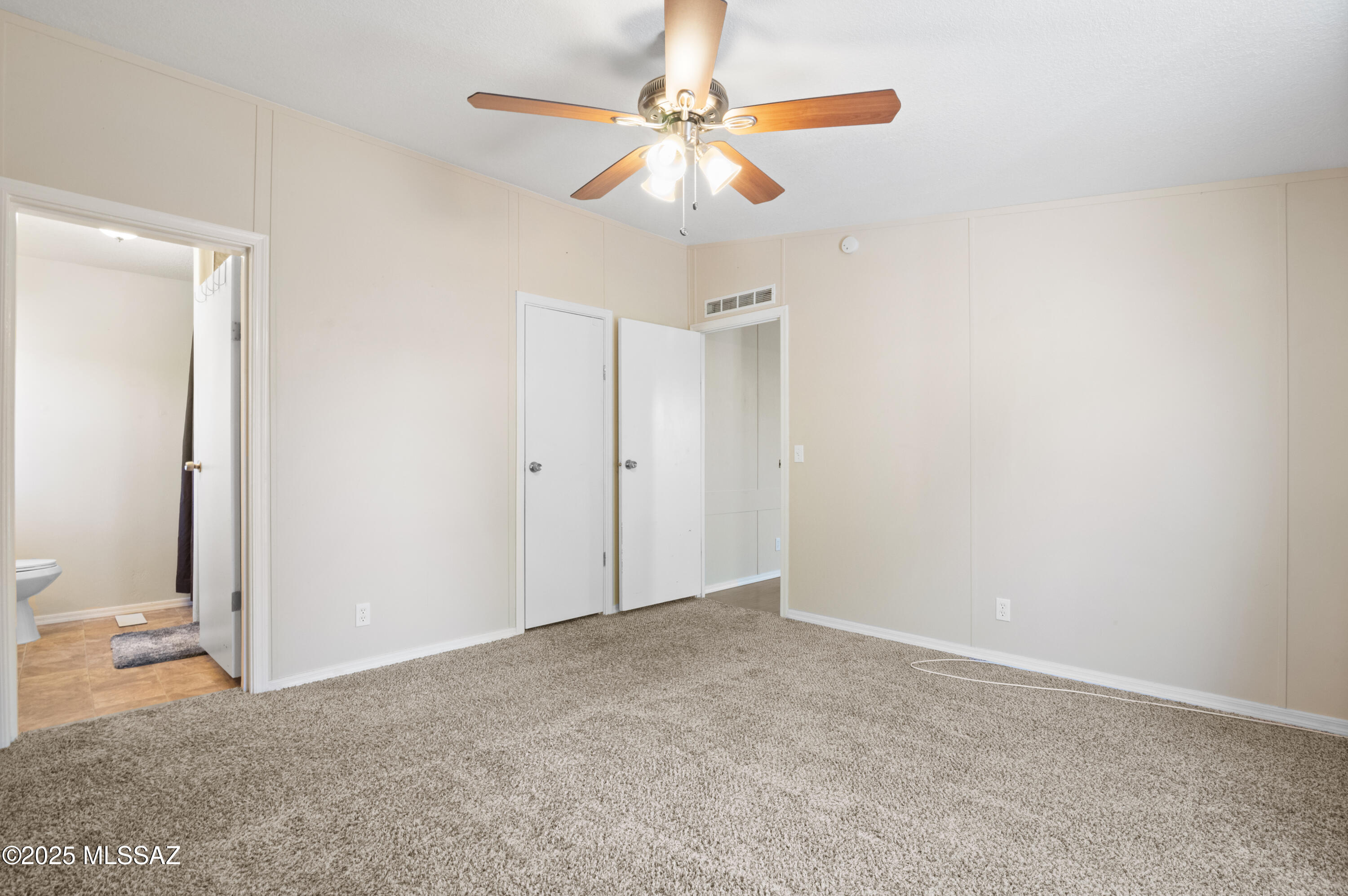 6205 East Rough Rock Drive Tucson, AZ 85756 - Photo 10 of 30 an empty room with closet and fan