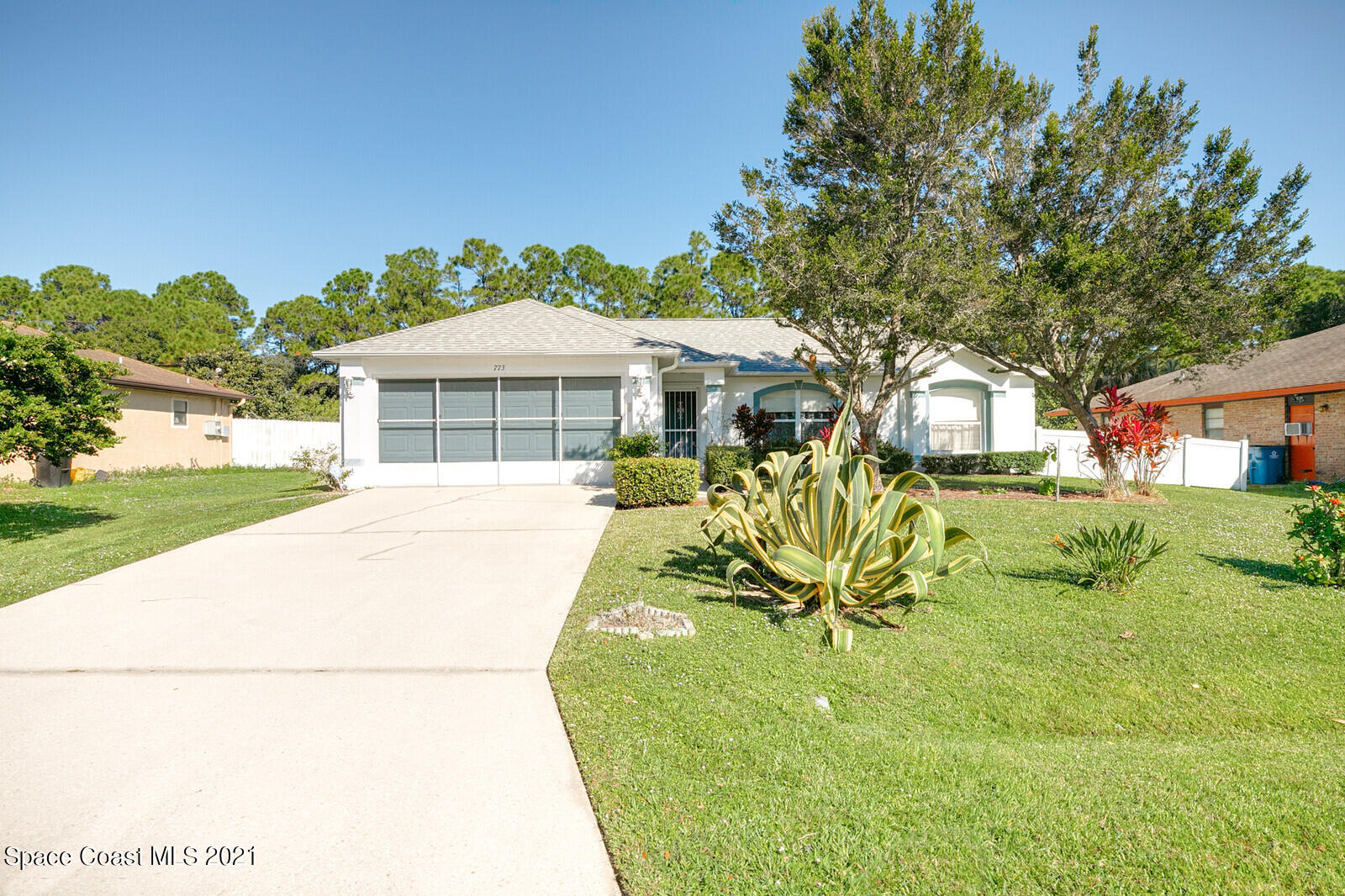 773 Furth Road Northwest Palm Bay, FL 32907 - Photo 1 of 29 a view of a house with a yard