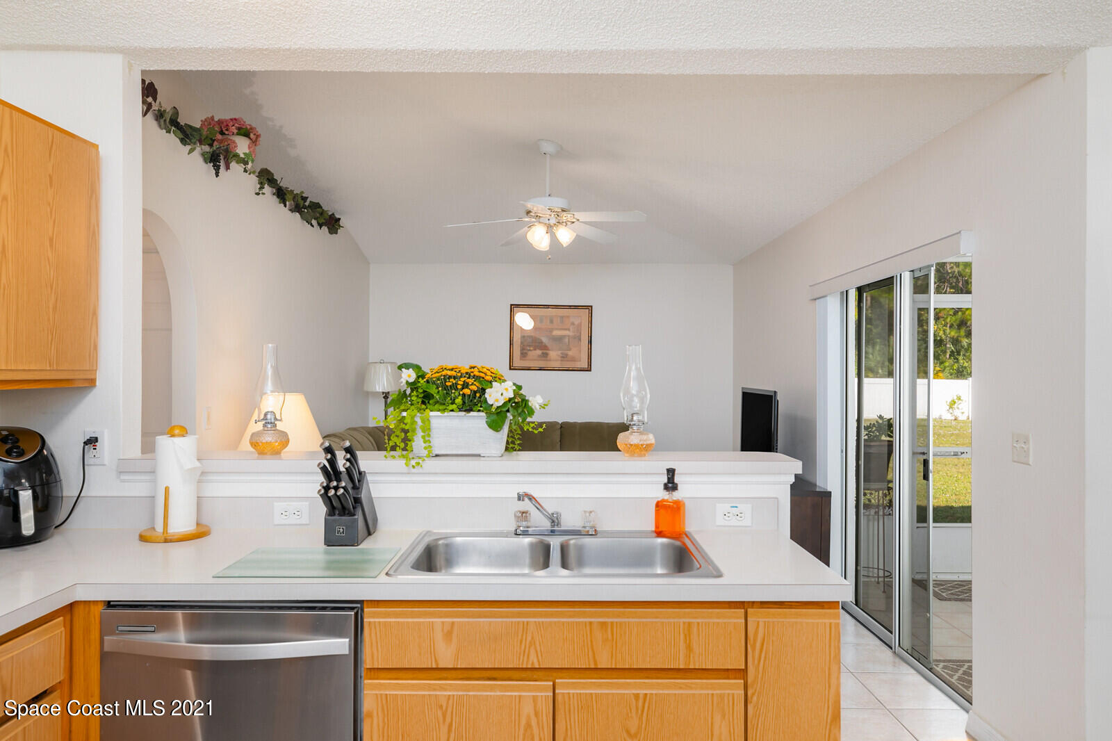 773 Furth Road Northwest Palm Bay, FL 32907 - Photo 11 of 29 a kitchen with a granite countertop sink and a white cabinets