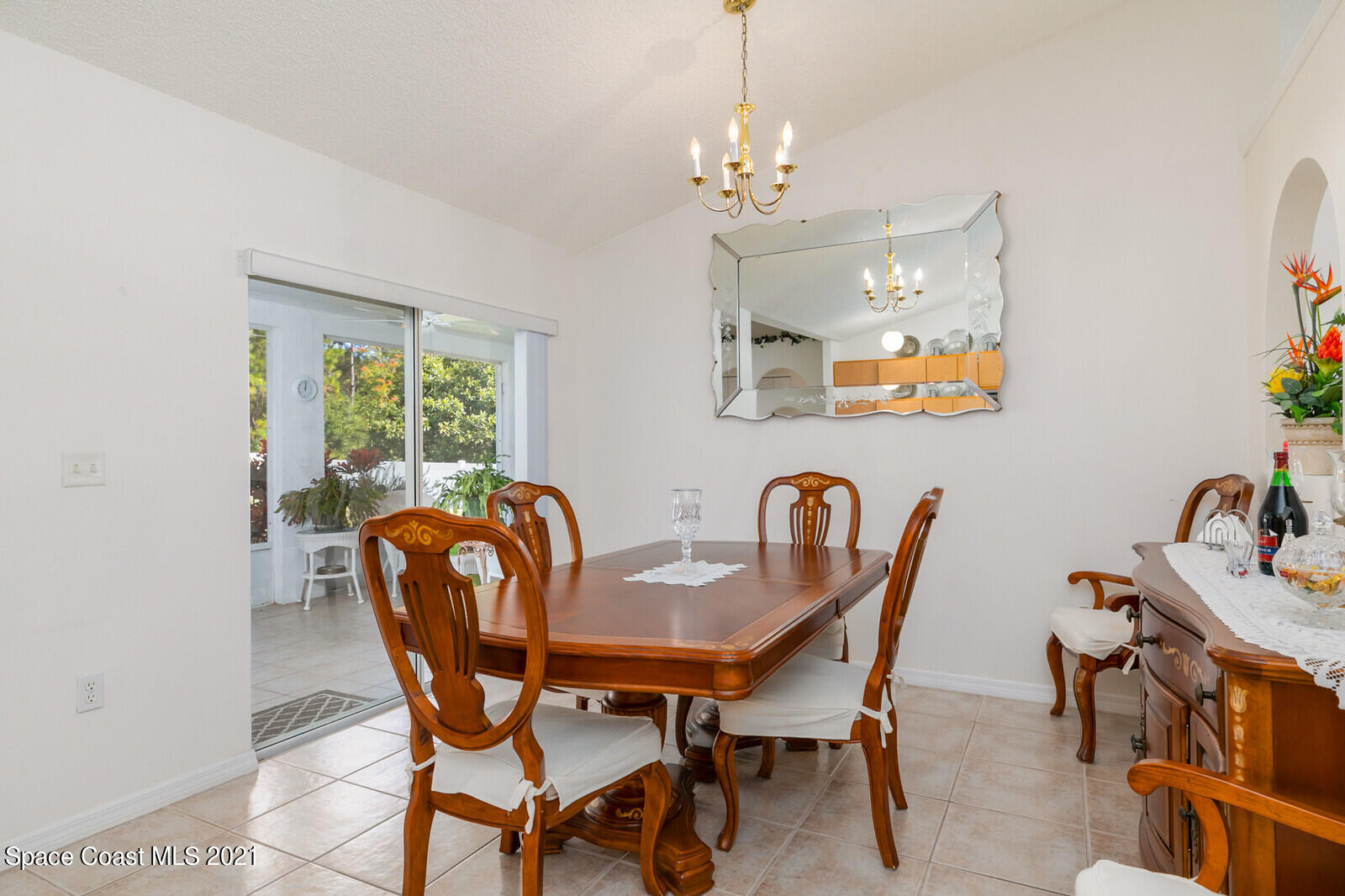 773 Furth Road Northwest Palm Bay, FL 32907 - Photo 12 of 29 a view of a dining room with furniture a chandelier and wooden floor