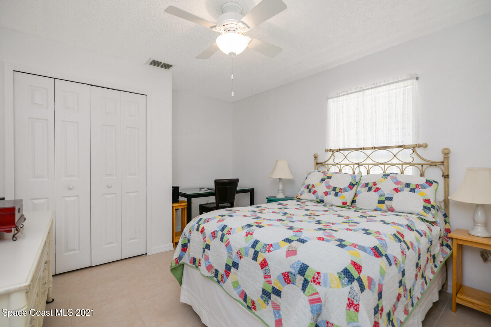 773 Furth Road Northwest Palm Bay, FL 32907 - Photo 22 of 29 a bedroom with a bed and a chandelier
