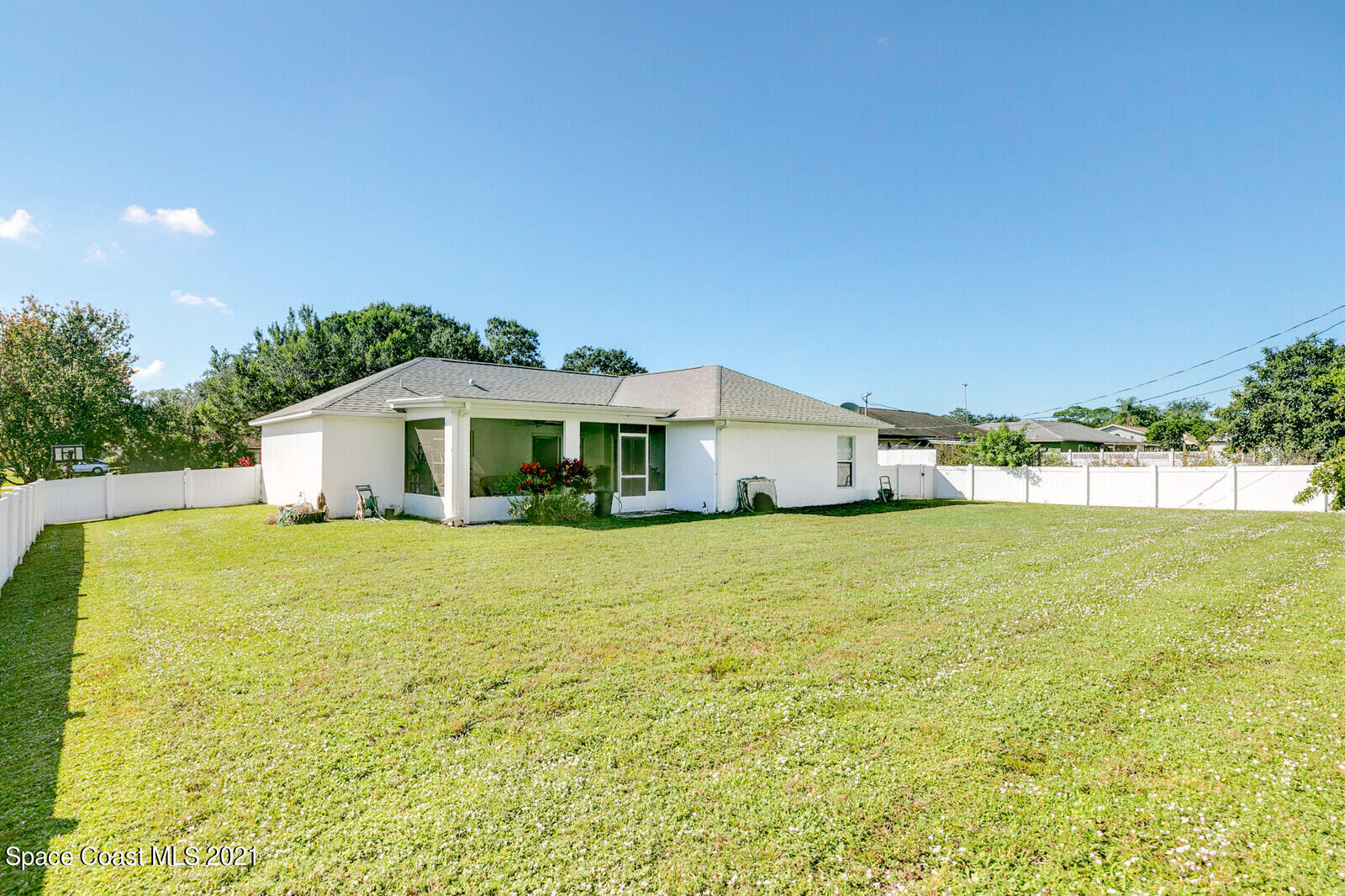 773 Furth Road Northwest Palm Bay, FL 32907 - Photo 26 of 29 a yellow house with trees in front of it
