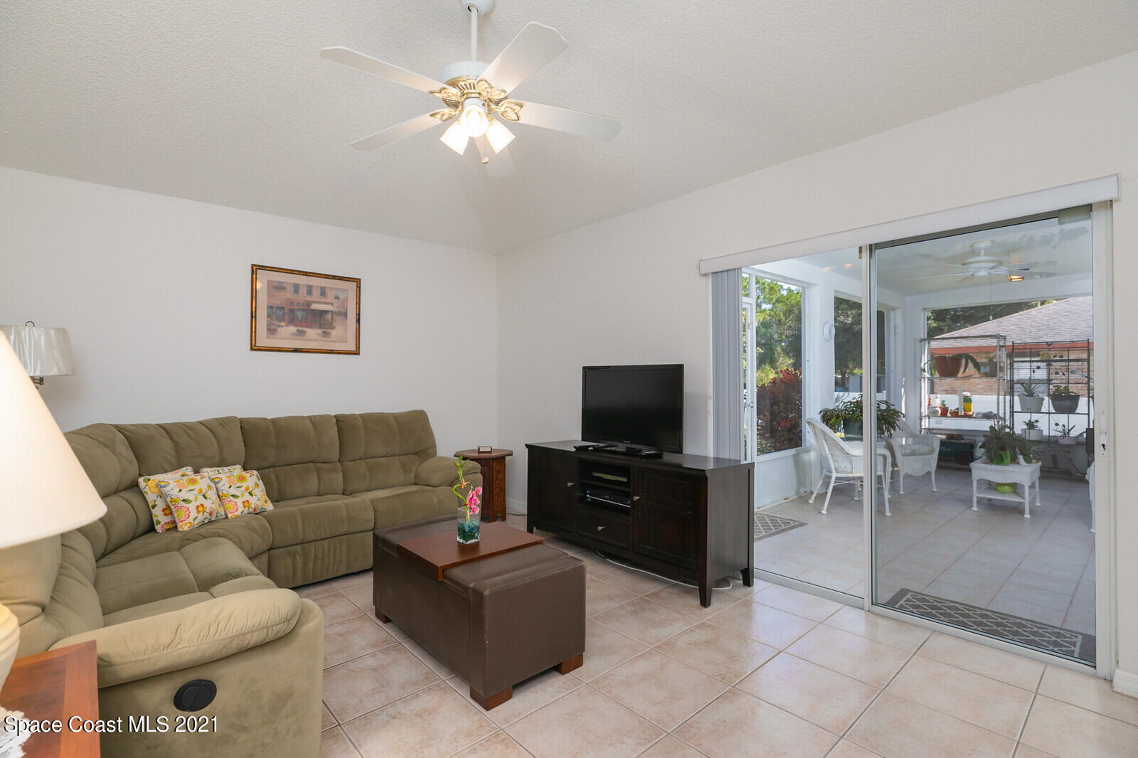 773 Furth Road Northwest Palm Bay, FL 32907 - Photo 5 of 29 a living room with furniture and a flat screen tv