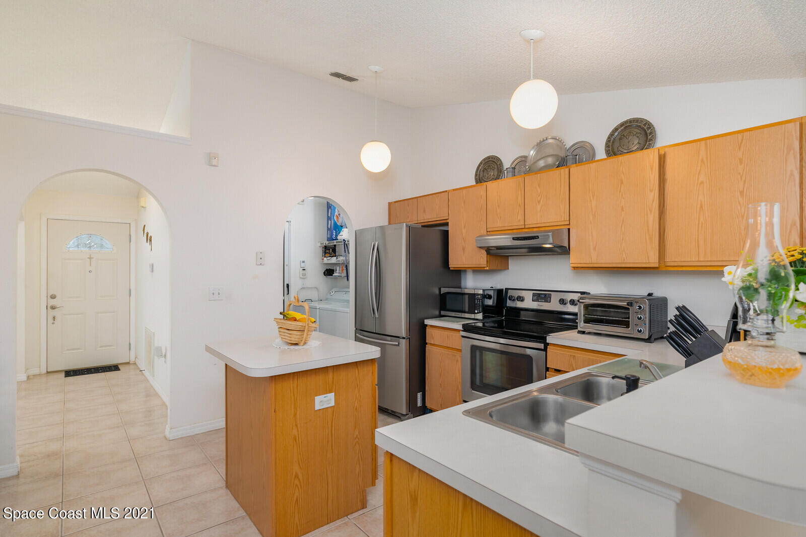 773 Furth Road Northwest Palm Bay, FL 32907 - Photo 9 of 29 a kitchen with stainless steel appliances granite countertop a stove top oven
