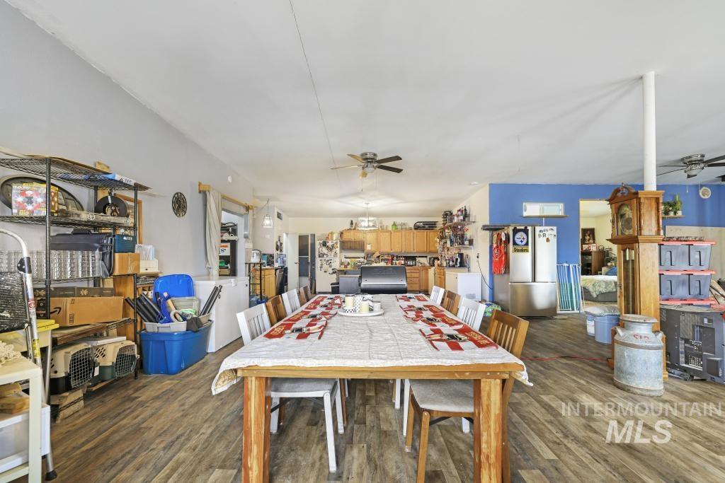 315 Wilson Street Eden, ID 83325 - Photo 11 of 30 Dining area featuring a ceiling fan and dark wood finished floors