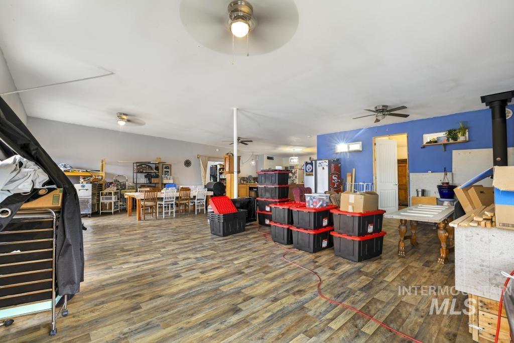 315 Wilson Street Eden, ID 83325 - Photo 14 of 30 Living room featuring dark wood finished floors and a ceiling fan