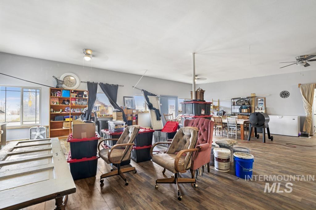 315 Wilson Street Eden, ID 83325 - Photo 15 of 30 Living area featuring a ceiling fan and dark wood-style flooring
