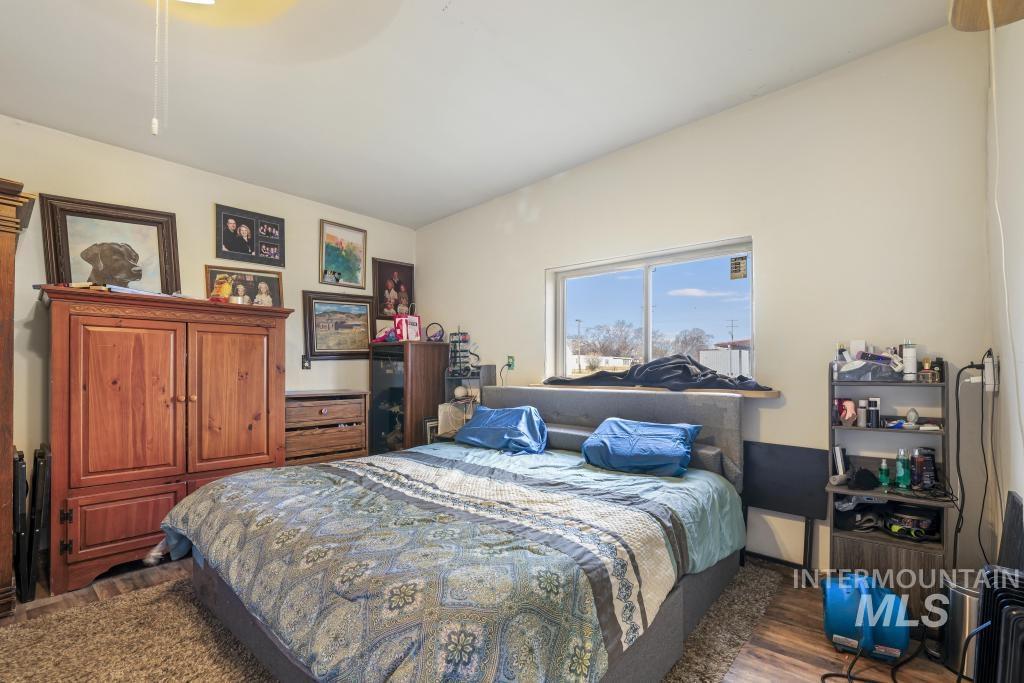 315 Wilson Street Eden, ID 83325 - Photo 16 of 30 Bedroom with ceiling fan and dark wood-type flooring