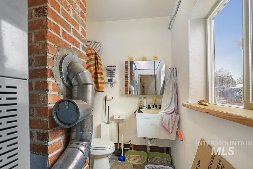 315 Wilson Street Eden, ID 83325 - Photo 18 of 30 Half bath featuring toilet and a sink