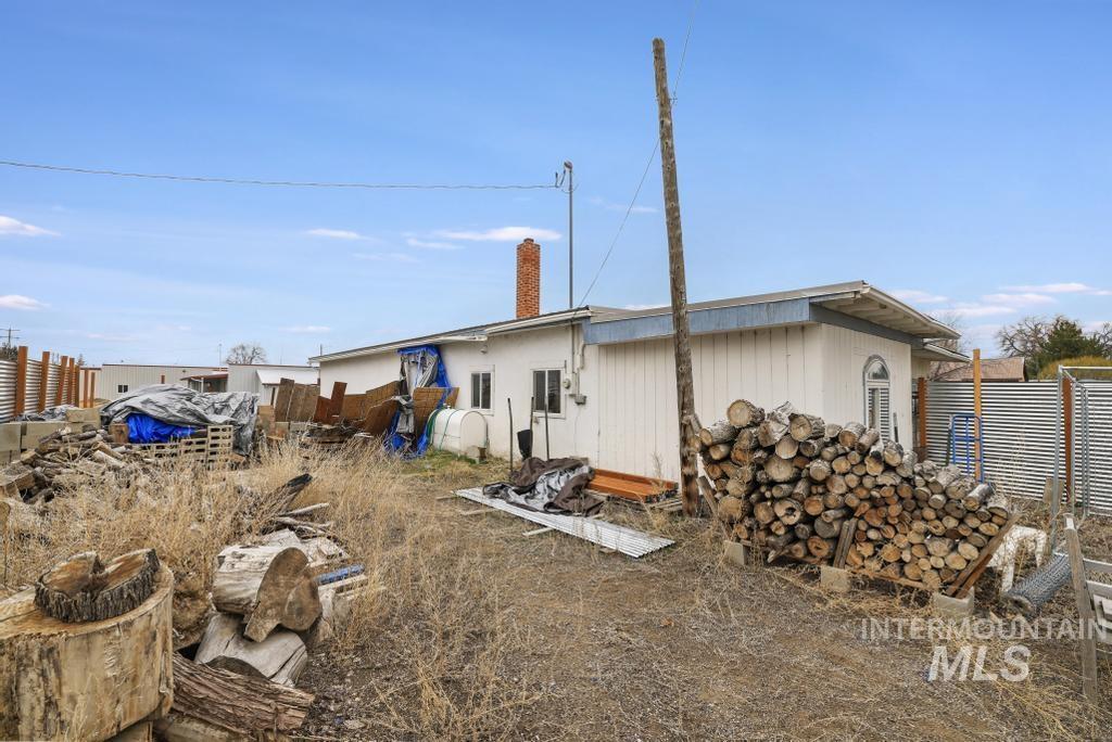 315 Wilson Street Eden, ID 83325 - Photo 25 of 30 Rear view of house with a chimney and heating fuel