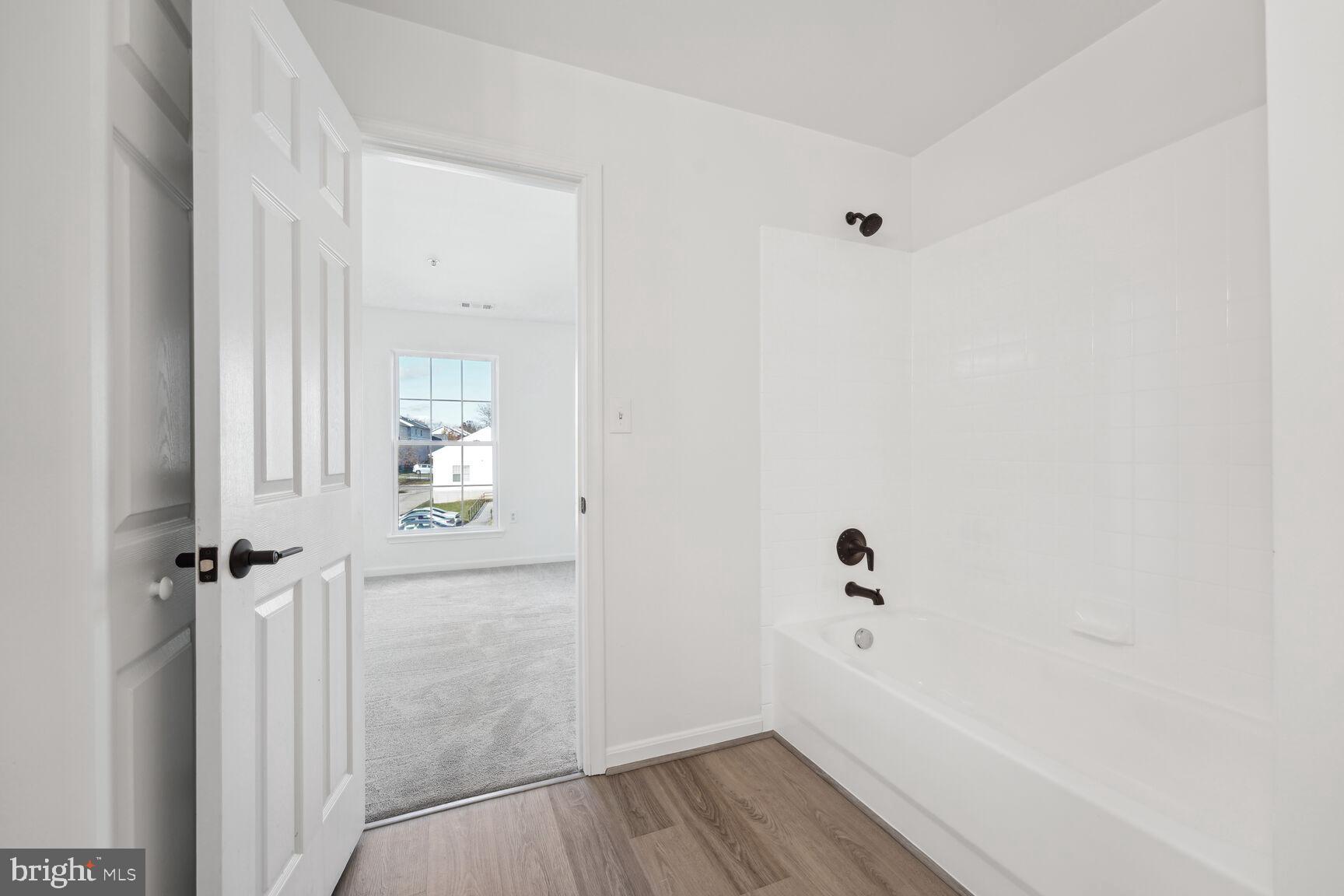 1510 Tubman Road Southeast Washington, DC 20020 - Photo 14 of 24 a view of a hallway with wooden floor and closet