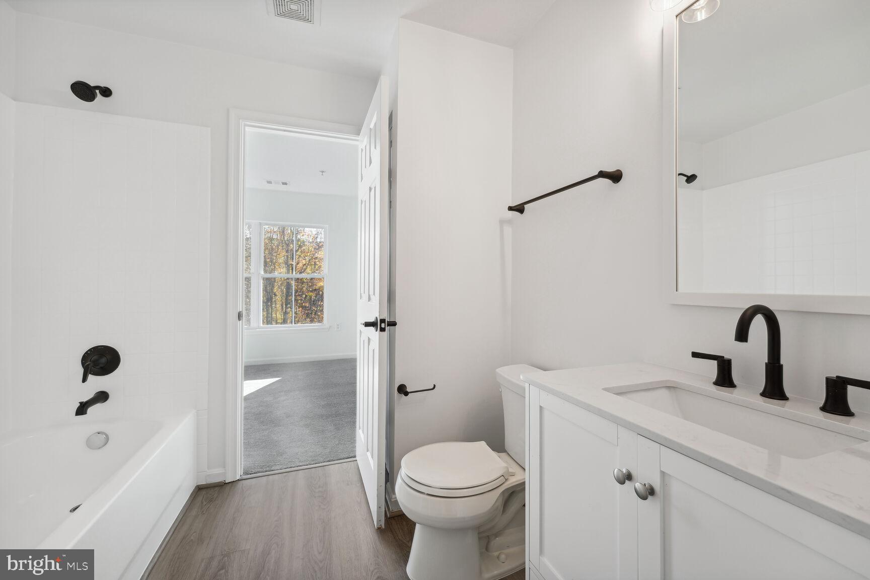 1510 Tubman Road Southeast Washington, DC 20020 - Photo 18 of 24 a bathroom with a sink toilet and shower