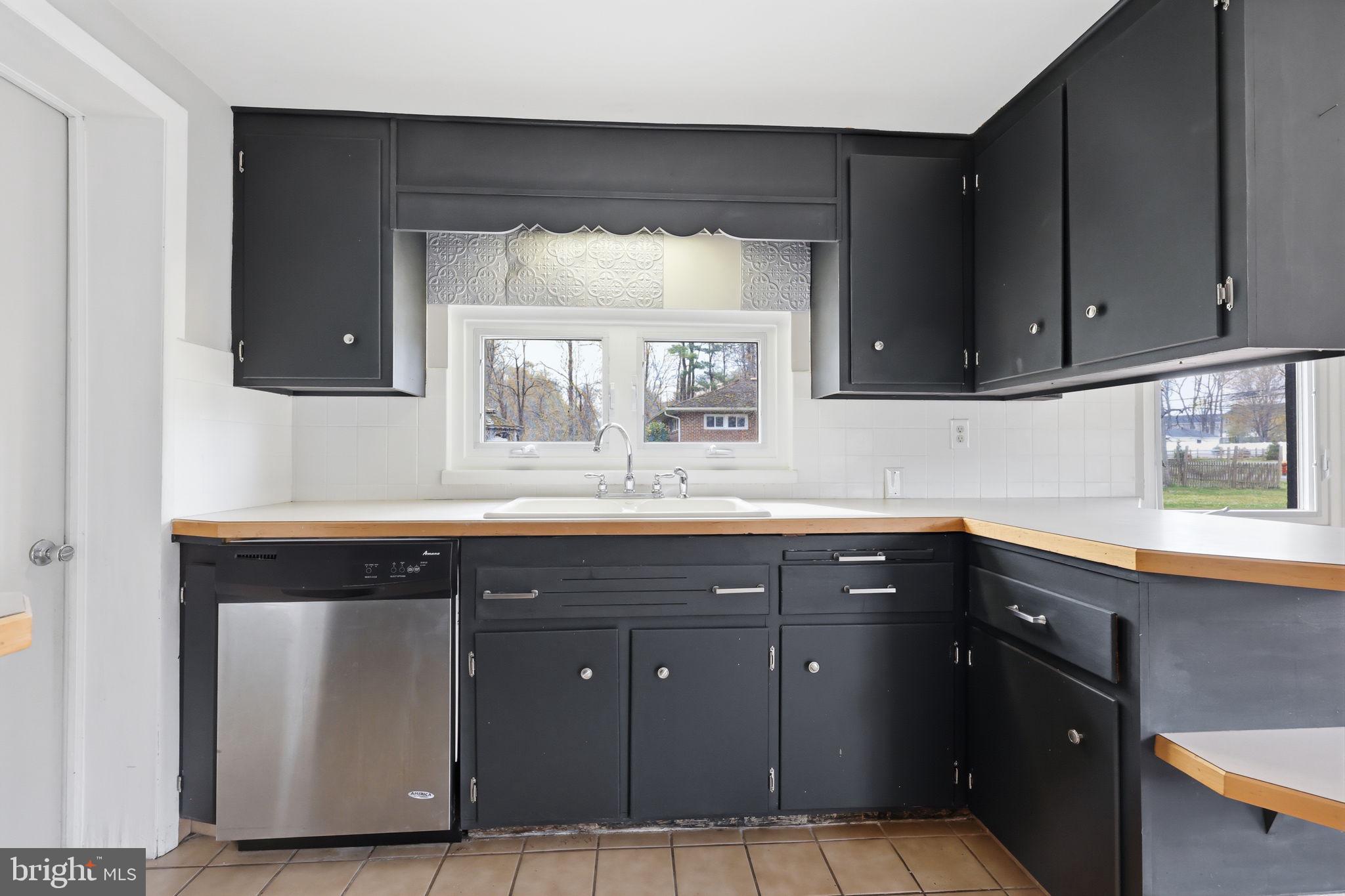 25 Diverty Road Pennington, NJ 08534 - Photo 20 of 37 Modern kitchen with sleek black cabinetry.
