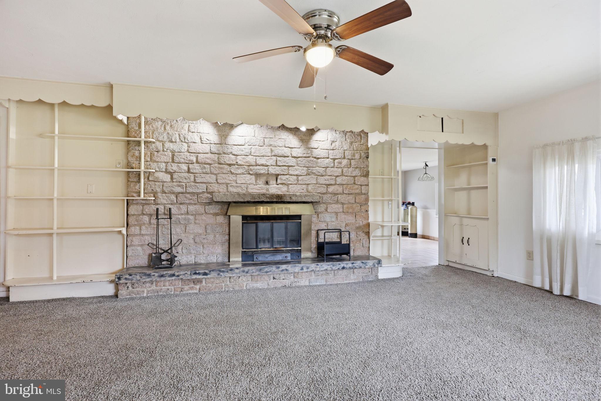 25 Diverty Road Pennington, NJ 08534 - Photo 4 of 37 Cozy living space with stone fireplace.