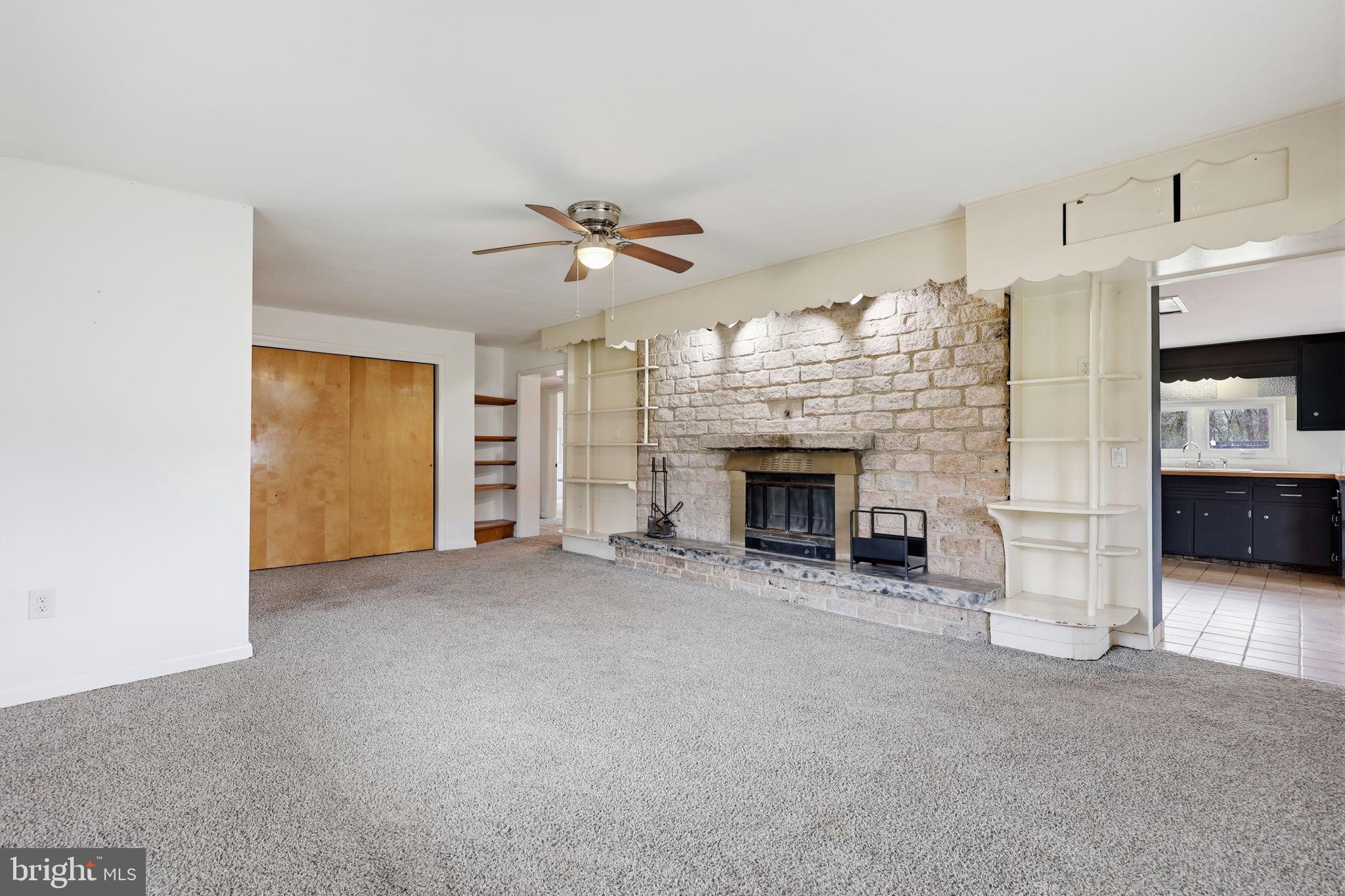 25 Diverty Road Pennington, NJ 08534 - Photo 5 of 37 Spacious living area with stone fireplace.
