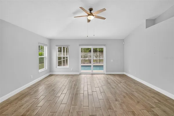 a view of empty room with windows