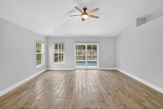a view of empty room with windows