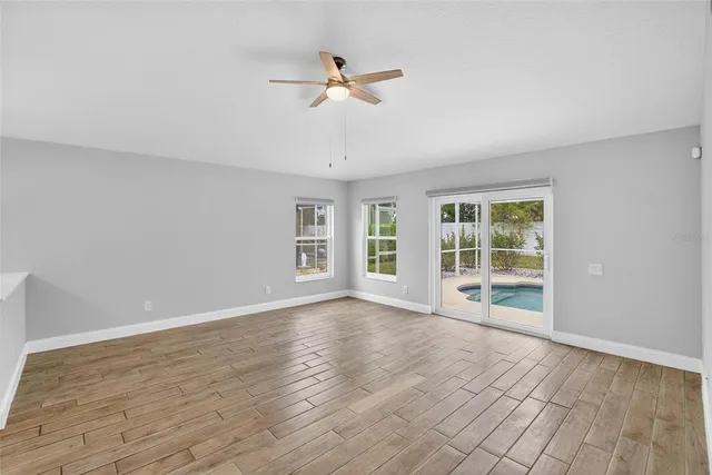 a bathroom with a granite countertop sink mirror and a bathtub