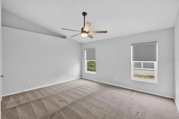 a bathroom with a granite countertop toilet a sink and a bathtub