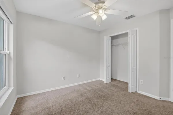 a view of a street with palm trees