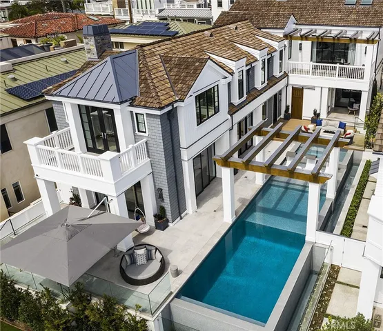 a view of a patio with couches chairs and potted plants