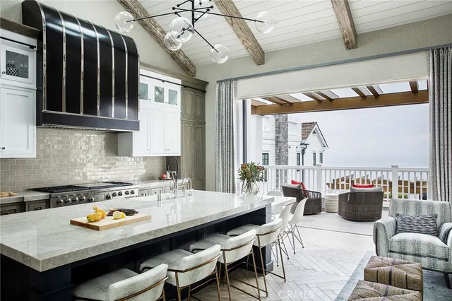 a kitchen with stainless steel appliances granite countertop a stove a sink dishwasher and cabinets with wooden floor