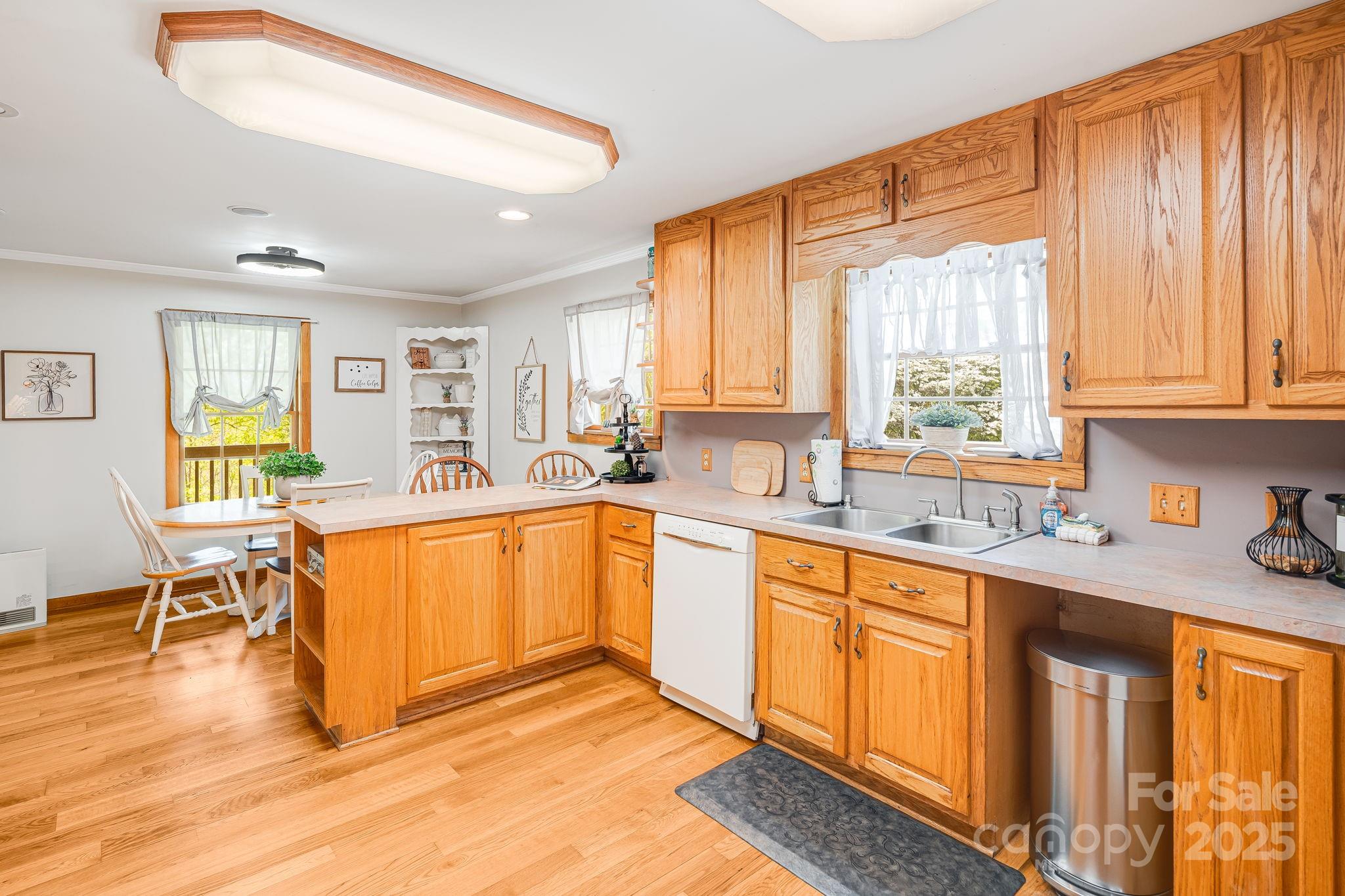 620 Mason Branch Road Bryson City, NC 28713 - Photo 15 of 43 a large kitchen with stainless steel appliances a sink window and cabinets