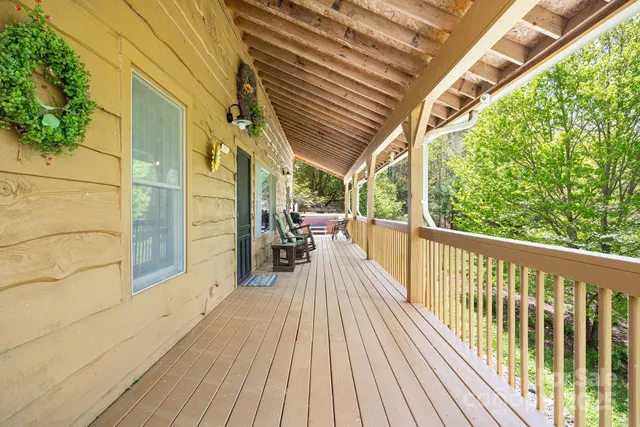 a view of a balcony with wooden floor