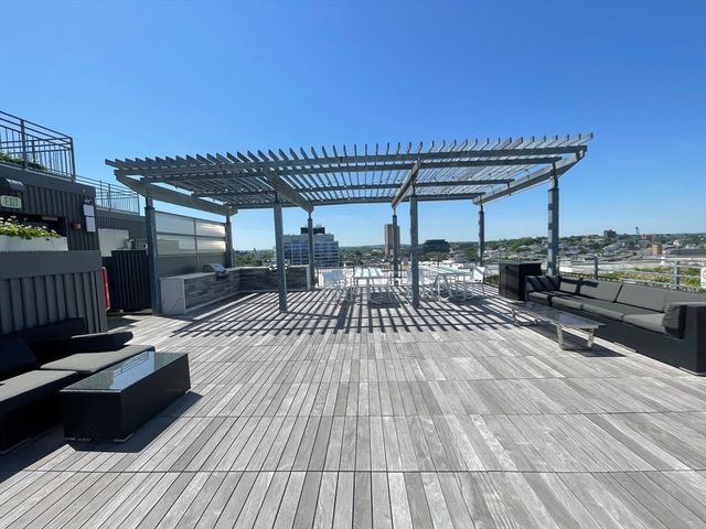 a view of a livingroom with furniture and a floor to ceiling window