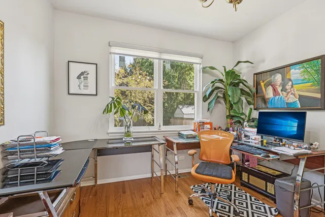 a workspace with furniture and a window