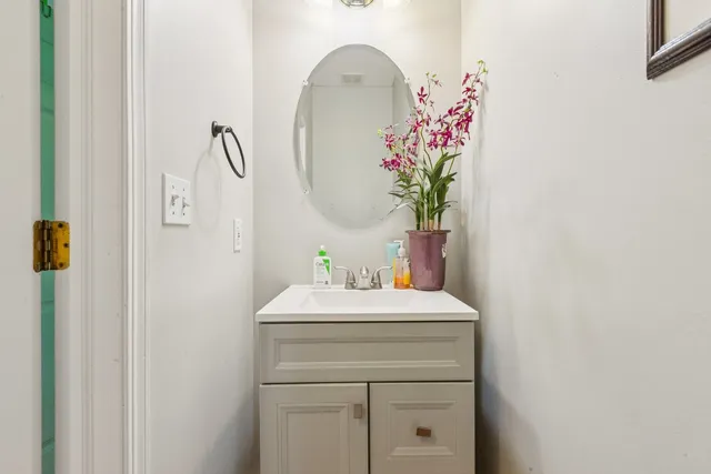 a bathroom with a sink and mirror