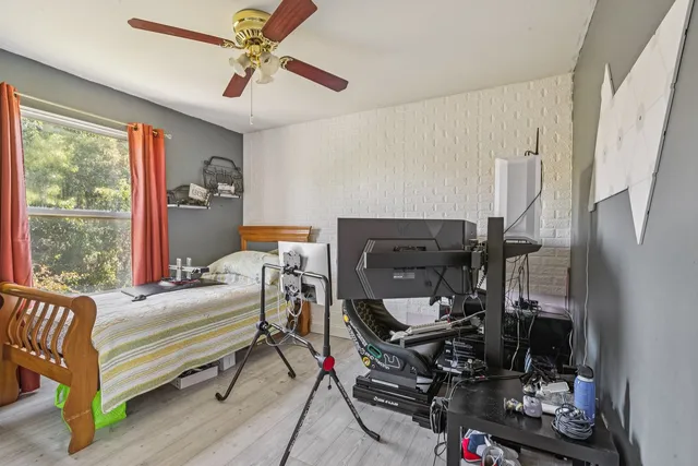 a bedroom with furniture and a window