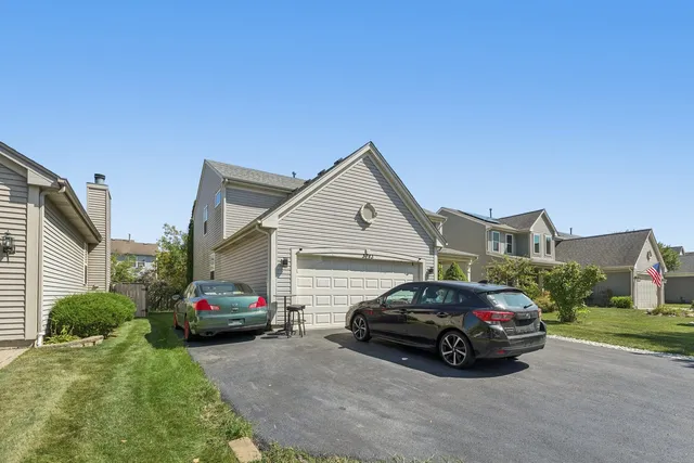 a view of a car parked in front of a house