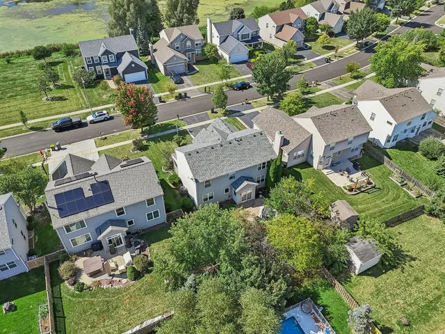 an aerial view of residential houses with outdoor space
