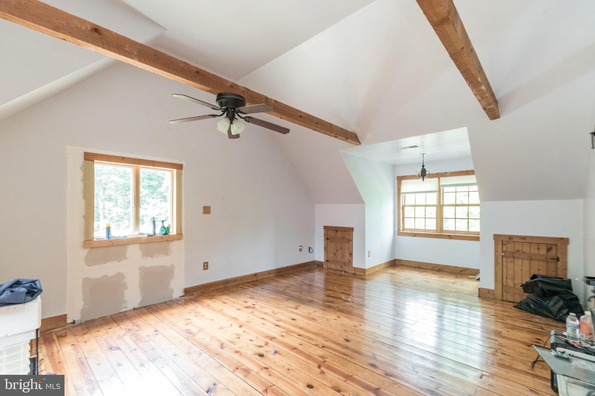 primary bedroom is BIG with exposed beams